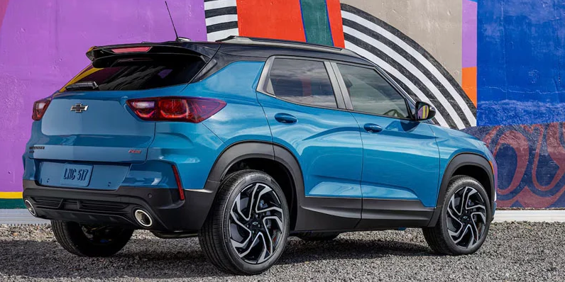 A photo of a 2025 Chevrolet Trailblazer parked with a mural in the backround.