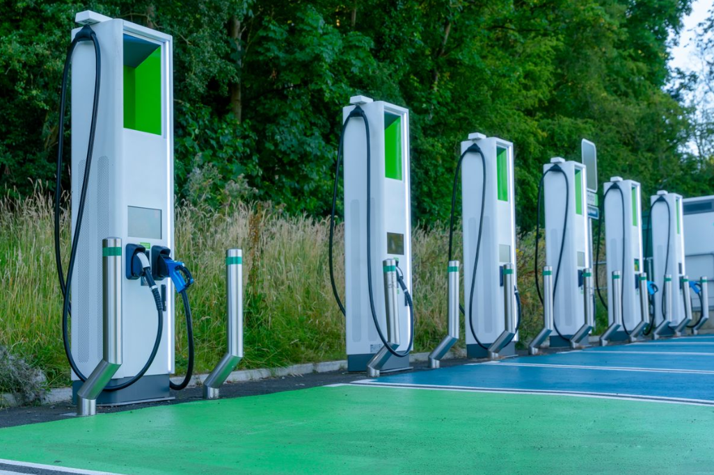 A photo of EV chargers in a parking lot.